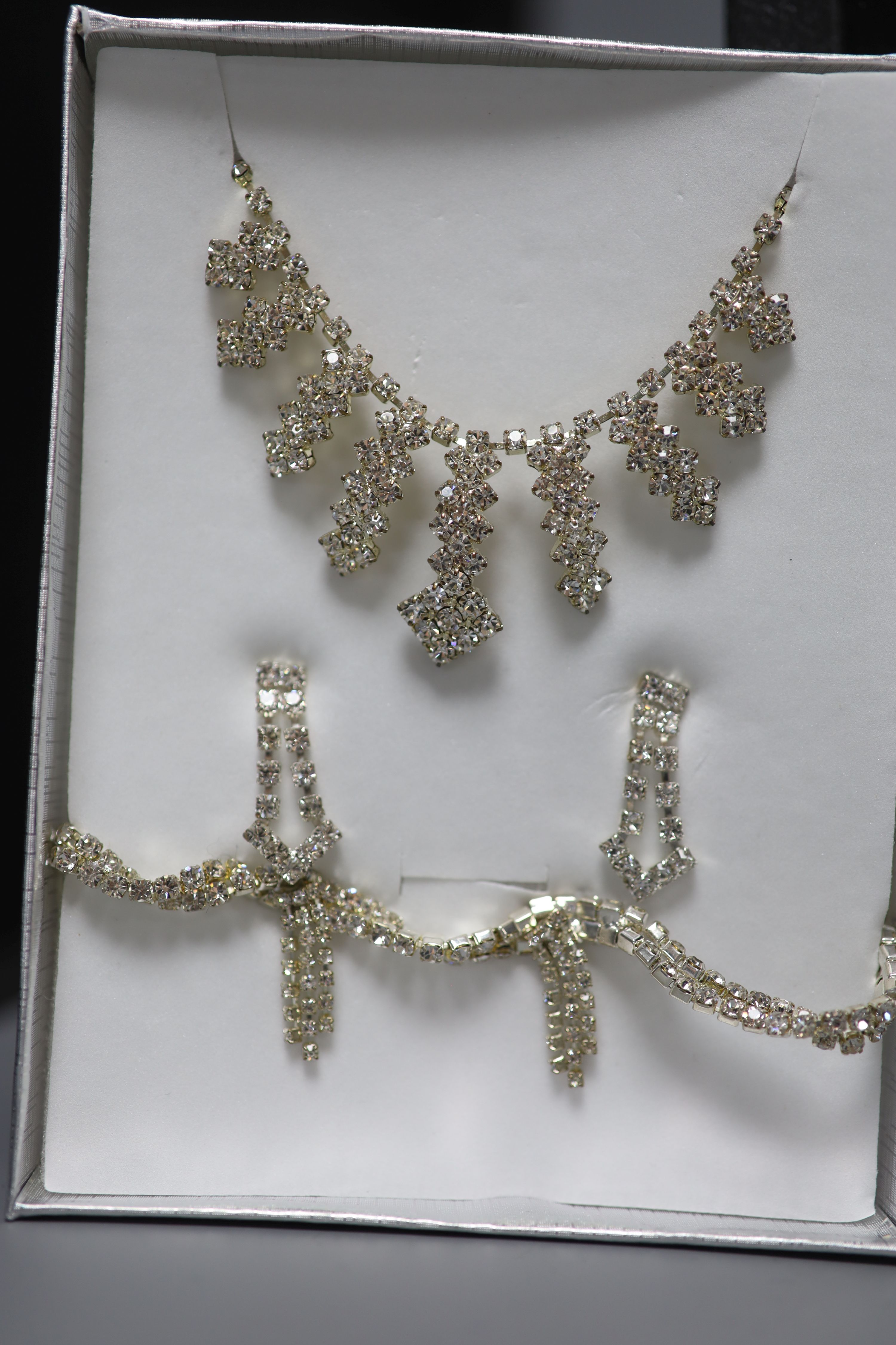 A large quantity of Swarovski costume jewellery and one hundred and thirty mainly 925 rings.